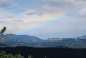 collegiatepeaksfromdeckwithrainbow Rainbow over the Coligiate Peaks from dech in Florissant, Colorado